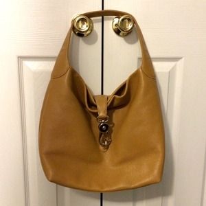 Dooney and Bourke logo lock in tan/natural color