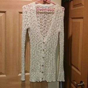Cream sweater. Size small but fits like a medium.