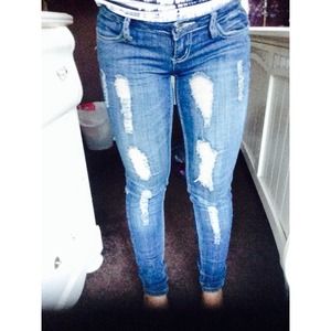 Ripped dark blue skinny jeans