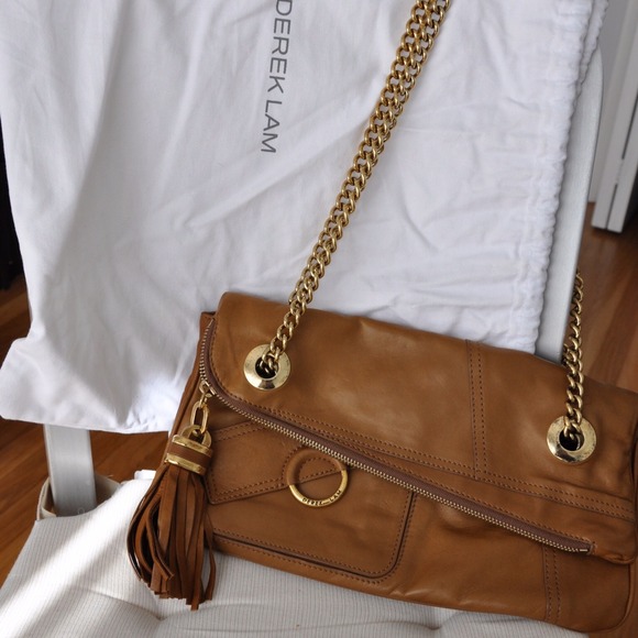 Authentic DEREK LAM gold chained shoulder bag.