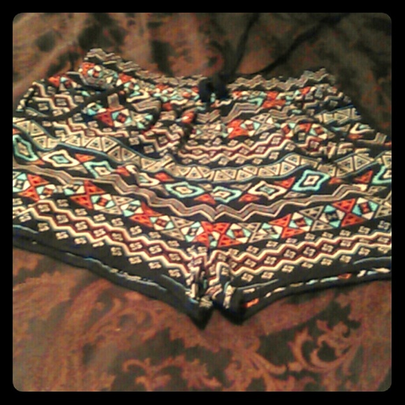 blue and red and white in black shorts