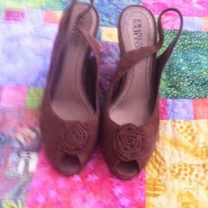 Chocolate brown wedge with rosette at peep toe.