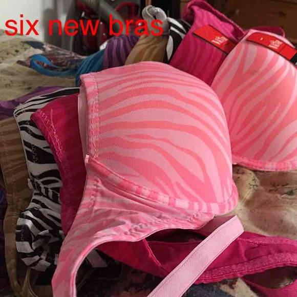 Six like new Tiger stripped bras. Size 34B