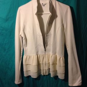 Beige dressy sweater with chiffon ruffle.