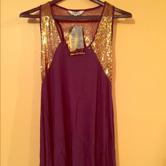 Purple and gold blouse.
