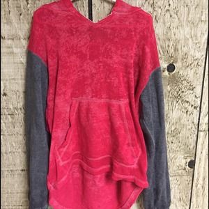 A pinkish red and grey sweatshirt