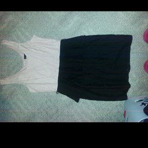 Light pink top/black bottomed dress.