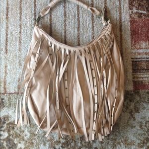A tan, fringe purse