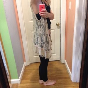 A tan lace vest