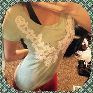 Pale green shirt with white embroidered design