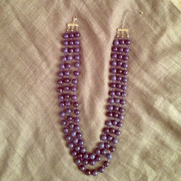 Three strand knotted bead midnight blue necklace.
