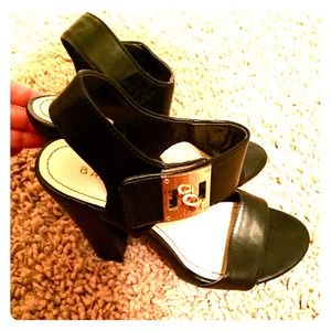 Size 7.5M black sandal. Worn once. Gold hardware.