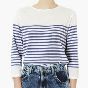 white top with blue stripes
