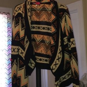 Orange,black and tan cardigan.