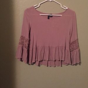 lavenderish brown shirt with designs in the arms