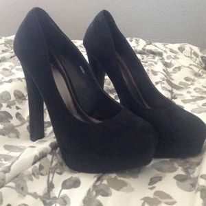 Black suede pumps/ high heels. About 5 inch heel