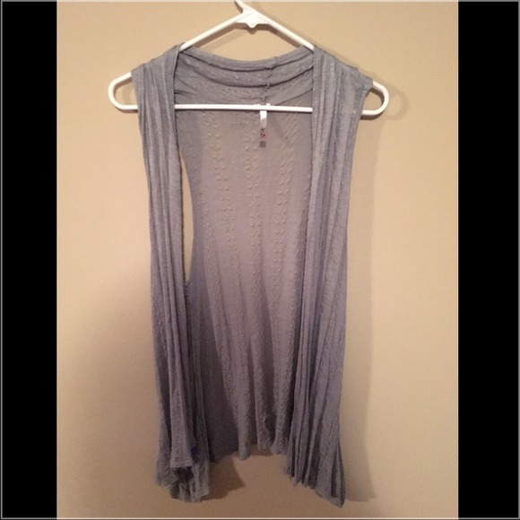 Grey long sleeveless cover up.