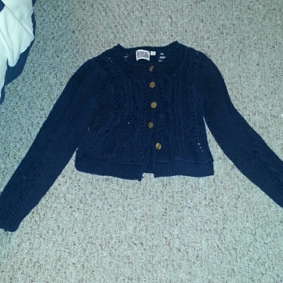 A cropped knit sweater