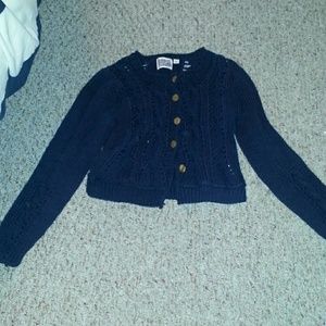 A cropped knit sweater