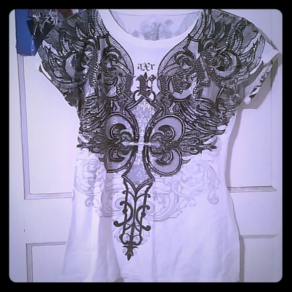White xzavier tshirt with rhinestones and design.