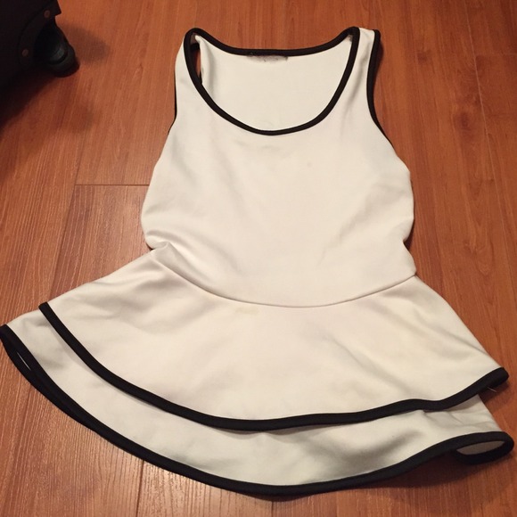 White peplum top with black piping