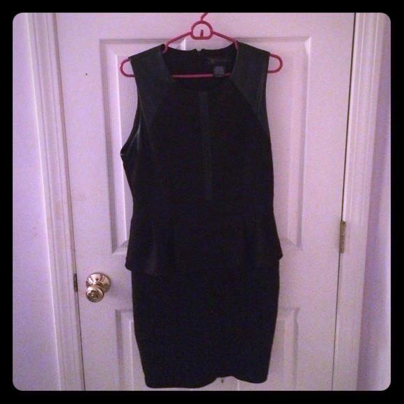Black form fitting peplum dress