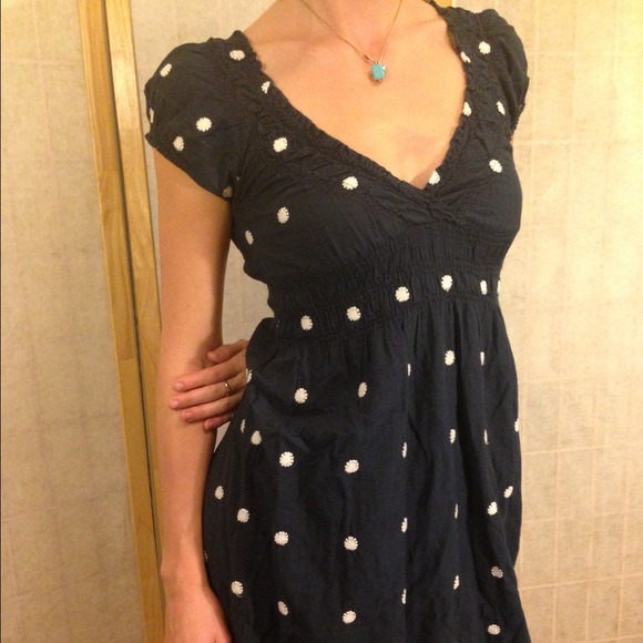 Navy blue dress with embroidered flower patterns