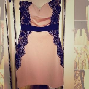 Nude colored tube dress with black laces!