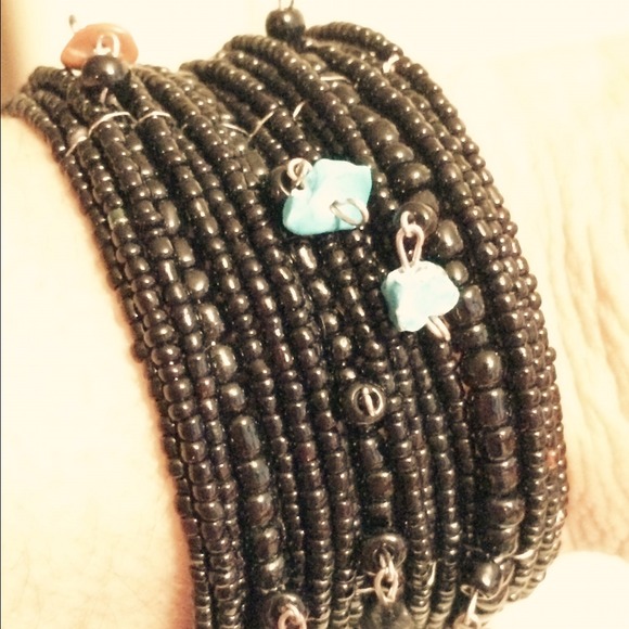 SOLD.   Black cuff bracelet with beads and stones
