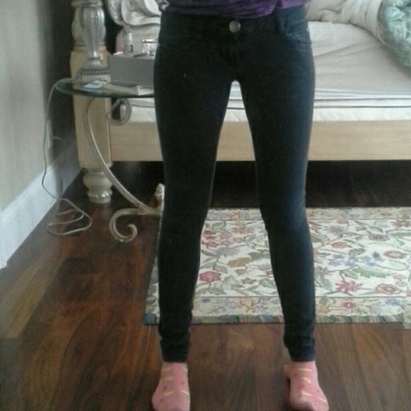 Faded out black skinny jeans