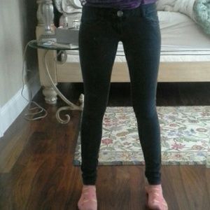 Faded out black skinny jeans