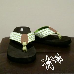 Lime and white polka-dot flip flops