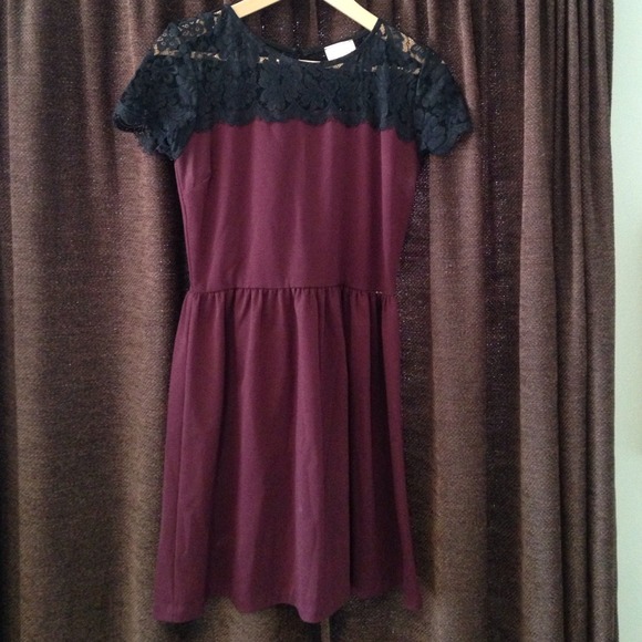 short red dress with black lace neckline