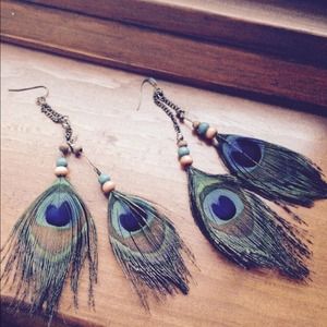 Beaded peacock feather earrings.