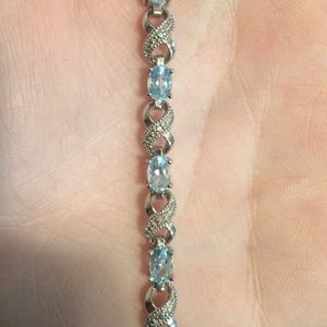 Diamond infinity and blue stone bracelet