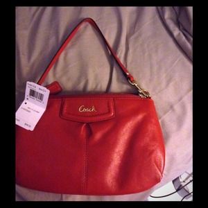 Authentic coach clutch