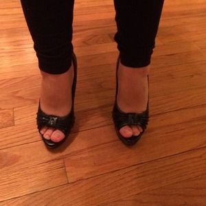 Black peep toe platform heels.