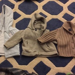Three baby boy sweaters with dark brown boots