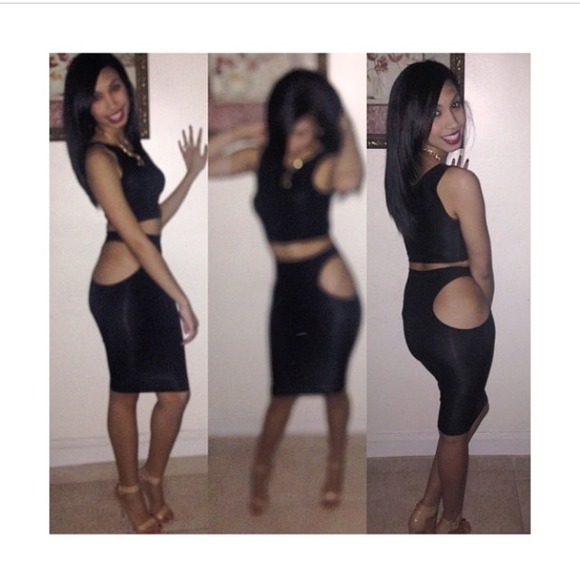 Black crop top and black skirt set.