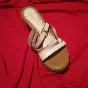 White & tan wedge shoe