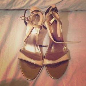 Beige and gold high heels.