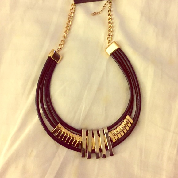 Leather necklace with gold and silver detail