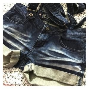 Brand new women's suspendered denim shorts.