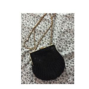 Carla marchi black purse with golden strap.