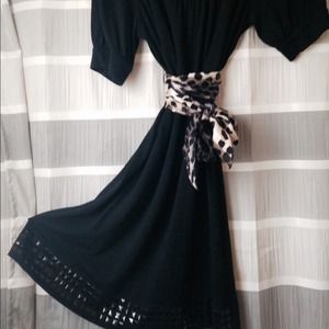 Black dress with black squares motif on hem