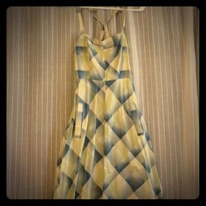 Cute vintage dress. Has pockets. X strap on back.