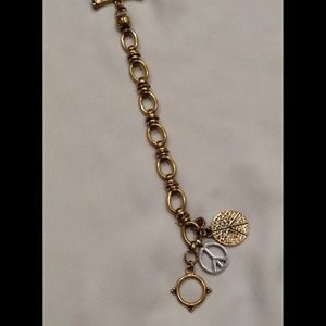 Lucky antique gold bracelet w/ 2 peace signs.