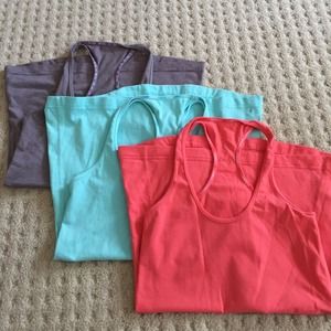 THREE LULULEMON TANKS