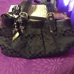 Black Coach purse with purse scarf.