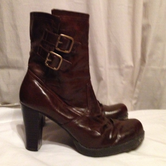 Brown ankle boots with buckles.